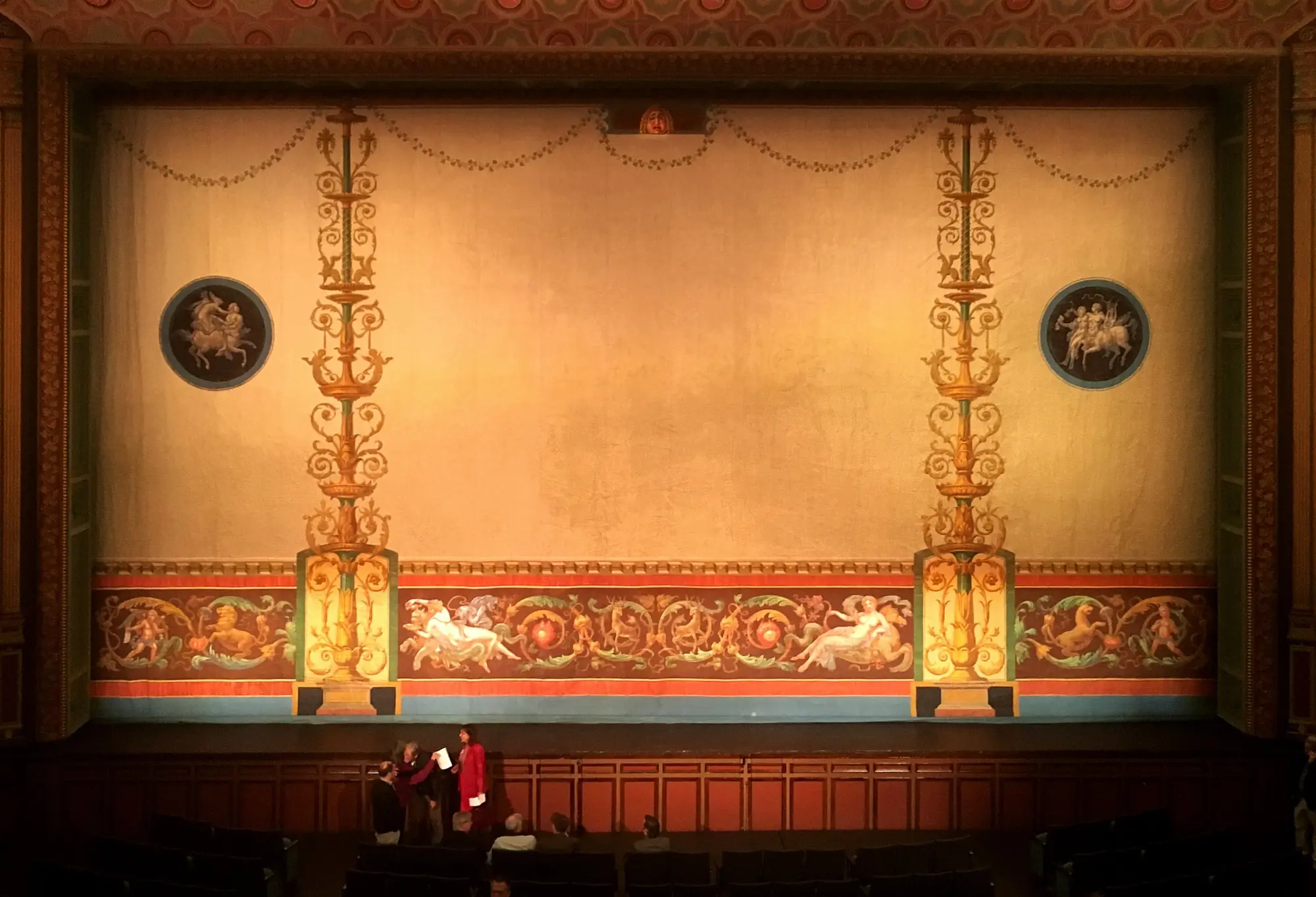 Hand-painted theatre fire curtain with gilded candelabra motifs, classical medallions and a grotesque frieze, restored by Le Grande Studios