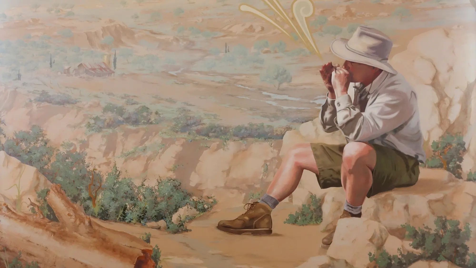 Mural at La Crescenta Library showing a hiker in a wide-brimmed hat drinking from cupped hands above the Crescenta Valley, with a barn and creek in the distance