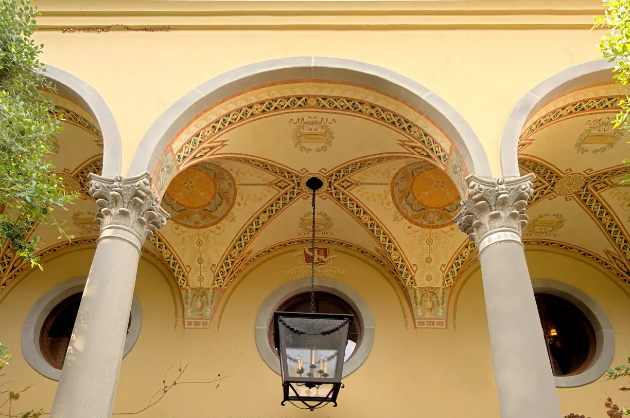 Loggia at a Palos Verdes residence with painted groin vaults, Italianate ornament, heraldic cartouches and Corinthian columns