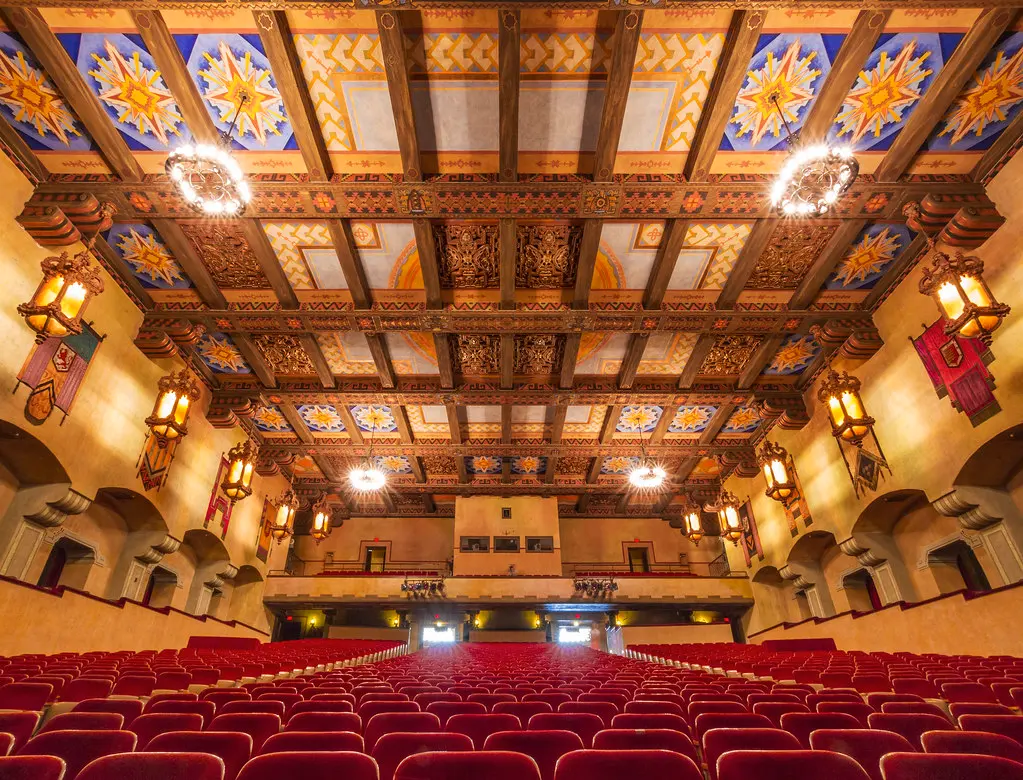 Decorative painted proscenium and fire curtain in a historic Southern California auditorium